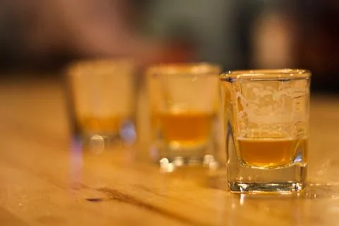 Shots of beer on a bar table Stock Photos