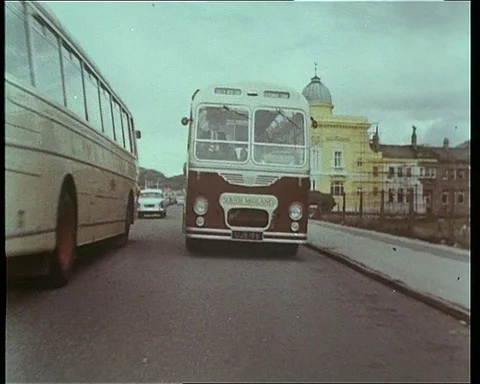 Shots of couch driving to final destination and passengers walking out, 1965 Stock Footage 132328727