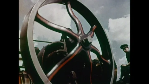 Shots of different working steam engines for sale on outside fair, 1966 Stock Footage 133381602