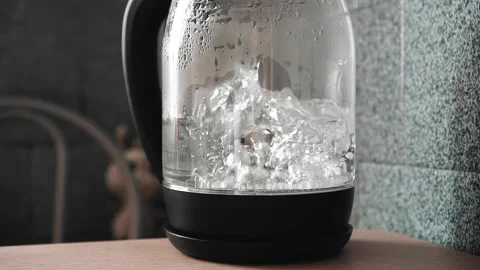 A Glass Electric Kettle With Boiling Water Inside Stock Photo