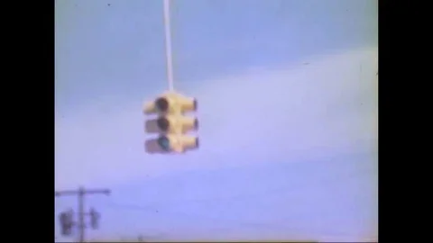 Shots of a traffic light, an interstate, a used car lot, and a sleeping Stock-Footage 147393467