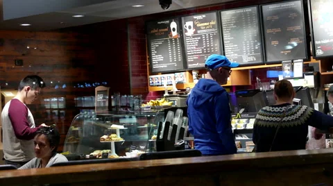 Shotting from outside window of customer buying coffee at Starbucks. Stock Footage 56719002