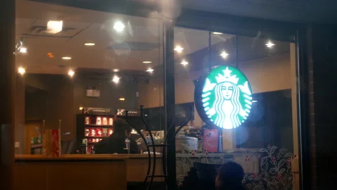 Shotting from outside window of heavy raining at Starbucks with 4k resolution. Stock Footage 143232560
