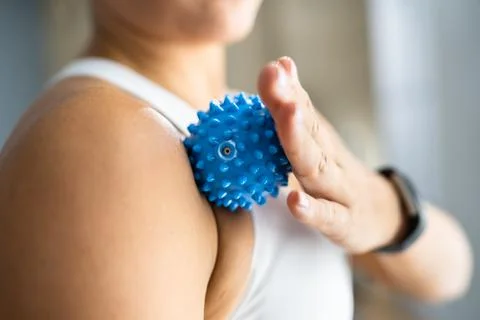 Shoulder Massage Using Trigger Point Spiky Ball Stock Photos