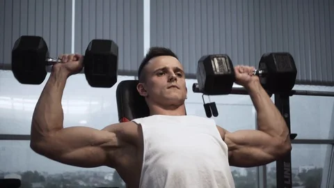 Shoulder press with dumbbells Stock Footage 117909431