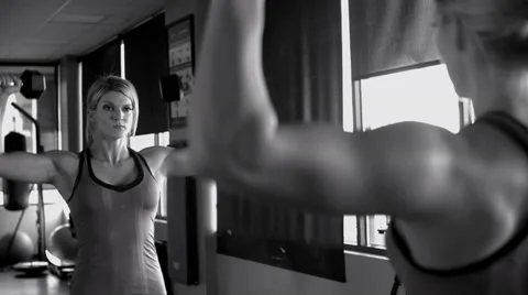 Shoulder press in mirror black with white with film grain Stock Footage 33666052