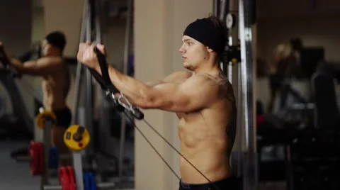 Shoulder raise in gym machine Stock Footage 55007673