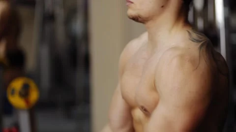 Shoulder raise in gym machine. Slow motion Stock Footage 55007709
