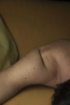 Shoulder on sofa Stock Photos