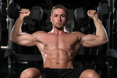 Shoulders Exercise In A Gym Stock Photos