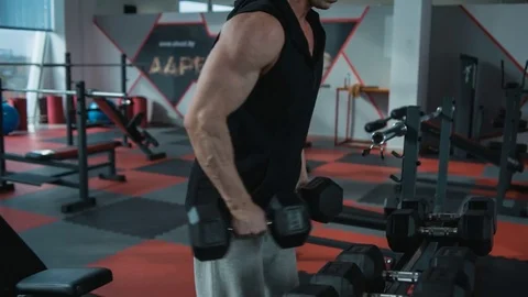 Shoulders workout with dumbbells Video stock 82349697