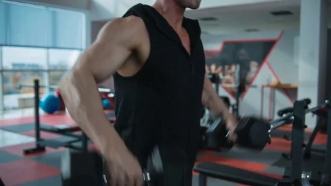 Shoulders workout with dumbbells. Loop Stock Footage 82349463