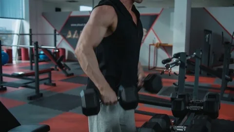 Shoulders workout with dumbbells. Loop Stock Footage 82349823