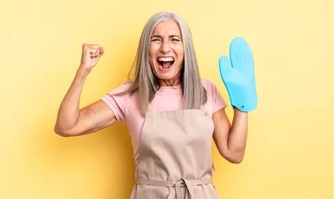 Shouting aggressively with an angry expression Foto stock