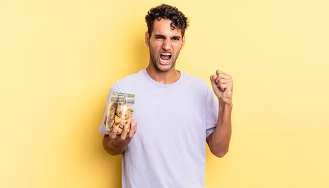 Shouting aggressively with an angry expression Stock Photos