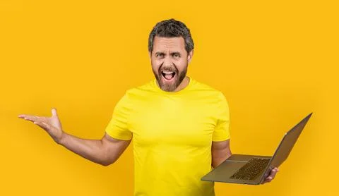 Shouting stressed man programmer on background. man programmer in studio. Stock Photos