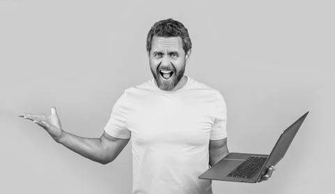 Shouting stressed man programmer on background. man programmer in studio. 스톡 사진