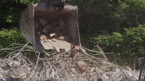 Shovel excavator, drops bricks on construction site. Stock Footage 24703587