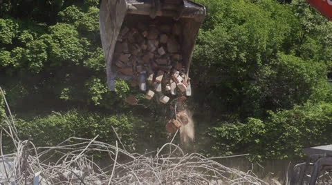 Shovel excavator, drops bricks on construction site. Stock Footage 24741909