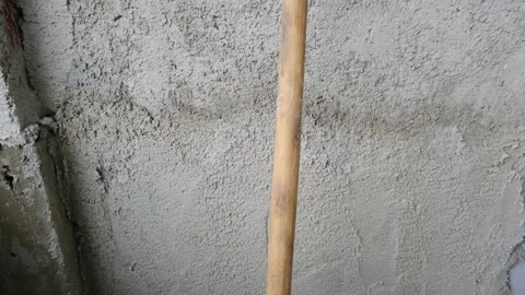 Shovel in front of the recently made plastered wall by concrete. Video stock 153120324