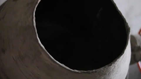 Shovel loading cement mixer drum closeup Stock Footage 314236150