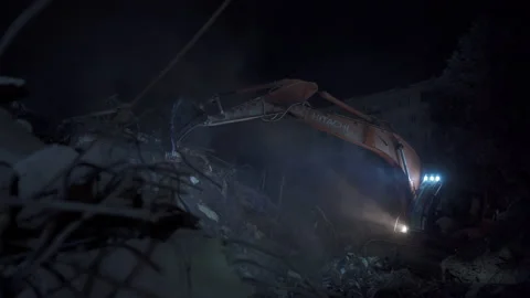 The shovel operator working precisely in the earthquake zone. Stock Footage 233222696