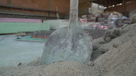 Shovel in sand at the construction site slow motion Video stock 252137344