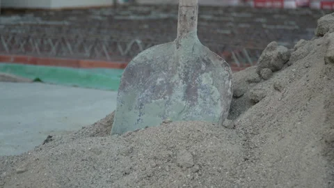 Shovel in sand at the construction site slow motion Stock Footage 252137392