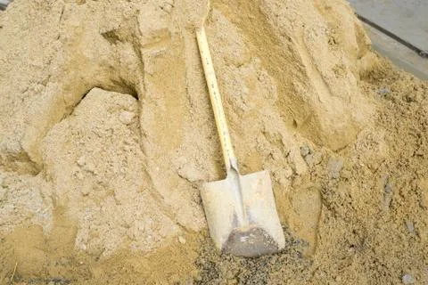 Shovel on sand Stock Photos