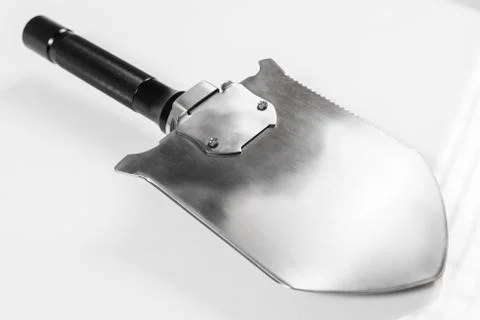 Shovel with a shock plate with function of hammer on a white background Stock Photos