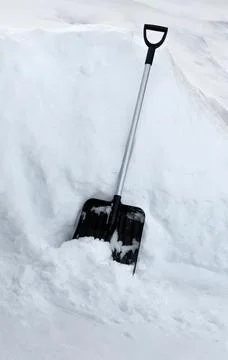 Shovel in snowdrift. Stock Photos