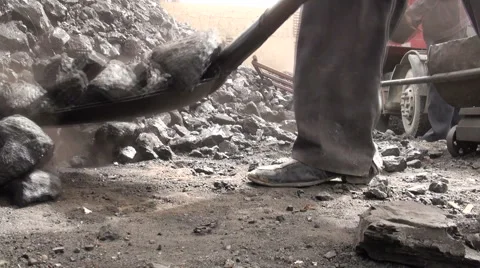 Shoveling coal by hand in Chinese village, poverty, China Stock Footage