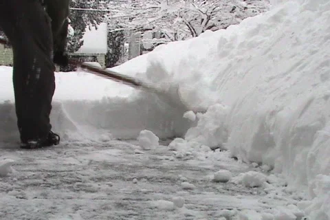 Shoveling Light Fluffy Snow Stock Footage