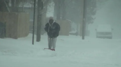 Shoveling the Sidewalk Stock Footage 54756612