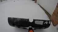 Shoveling Snow On Driveway In Front Of Garage Stock Footage