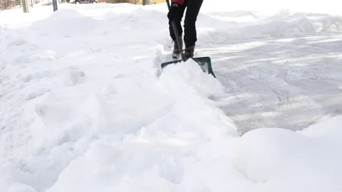 Shoveling Snow Stock Footage 102867931