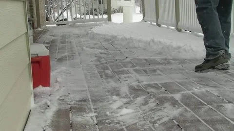 Shoveling Snow off porch Stock Footage 18171253