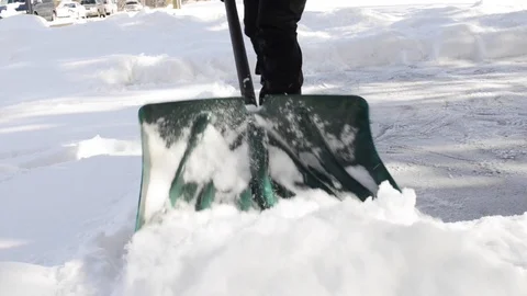 Shoveling Snow Toward Camera Stock Footage 102867719
