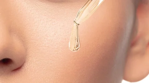 Show drops of a skin serum with a skin treatment..3d Stock Footage 152867553
