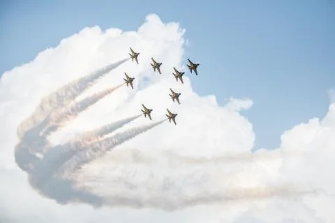 Show of force jets, planes carry a figure on a background of clouds Stock Photos