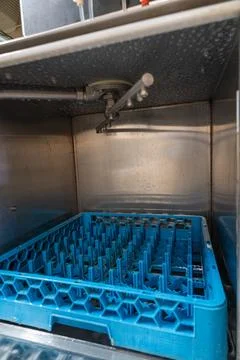 Show inside of the dishwasher machine. Stock Photos