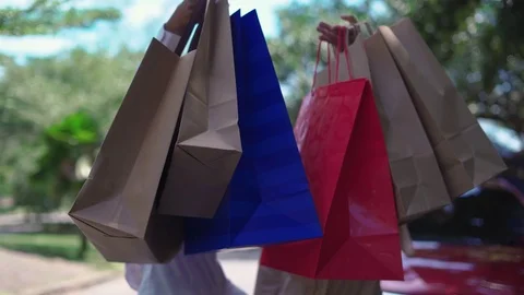 Show two young women each other stuff in the bag, shopping, lifestyle Stock Footage 107750882