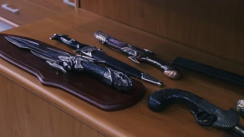 Showcase with ancient knives Stock Footage 86391373