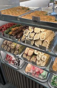 Showcase with assorted oriental sweets, featuring vibrant colors Stock Photos