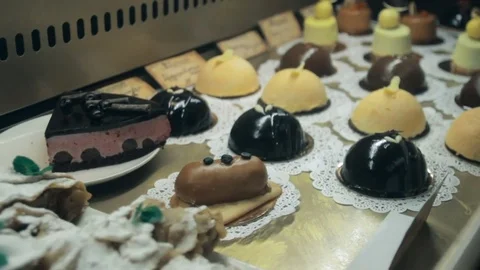 Showcase of cakes, pastry in window display Stock Footage 73784119