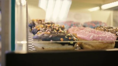 Showcase of cakes, pastry in window display canteen for tasty desert food. Video stock 82742524
