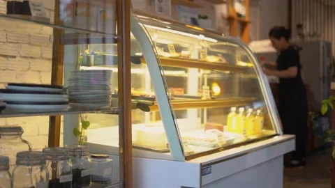 Showcase display in a cafe featuring a variety of desserts and treats Stock Footage 238739872