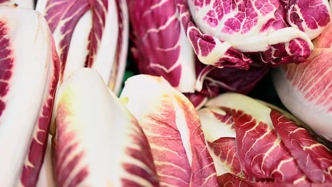 Showcase With fresh organic zero-carbon radicchio  On The Street Market in italy Stock Footage 104261703