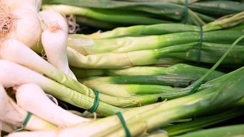 Showcase With fresh organic zero-carbon spring onion  On The Street Market  Stock Footage 104262237