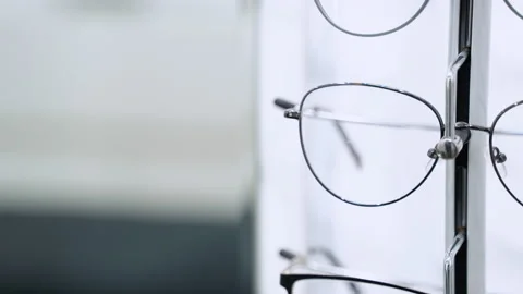 Showcase with glasses in modern optic store Stock Footage 231676578